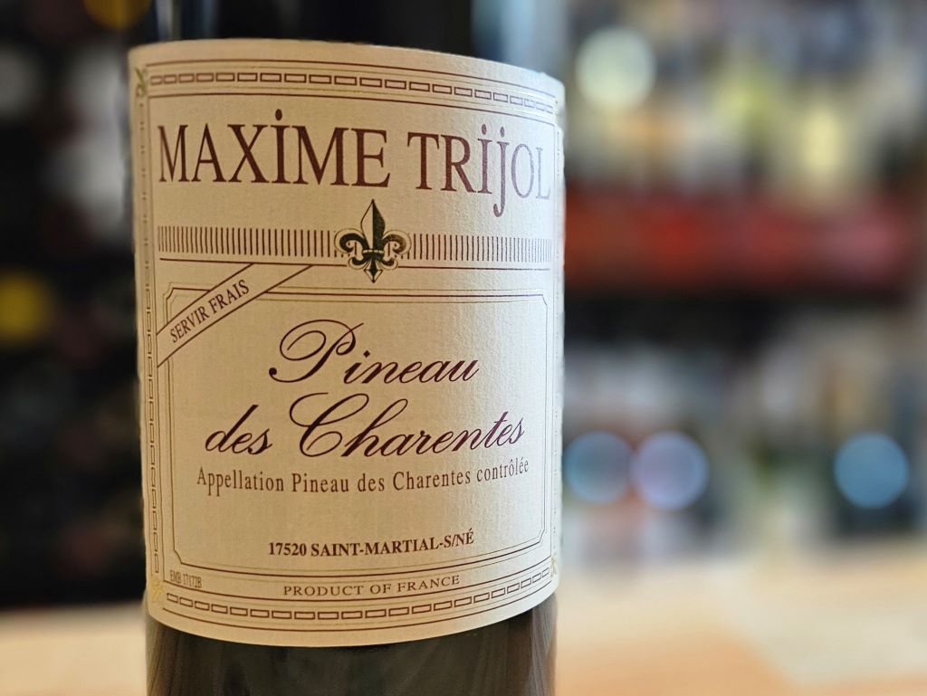 A bottle of Maxim Trijol Red Pineau des Charentes