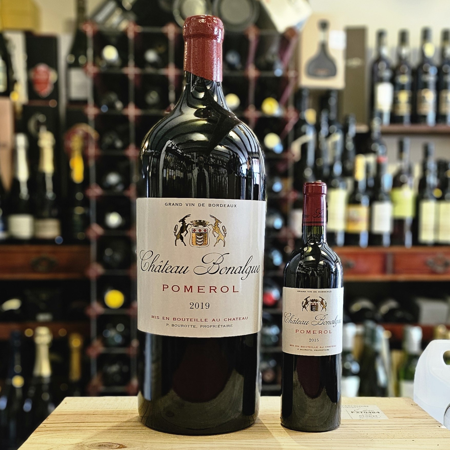 A 6 Litre Imperial of Chateau Bonalgue next to a standard 75cl bottle