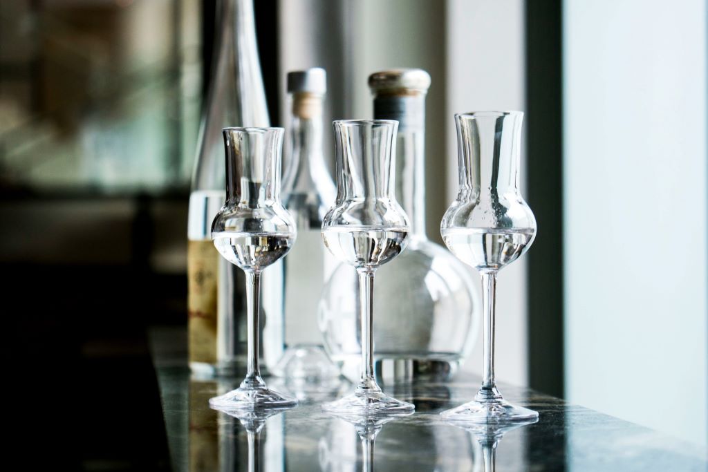 Grappa Bottles and Traditional Tulip Shaped Grappa Glasses